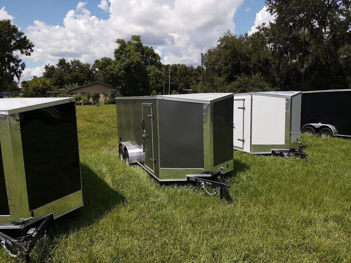 Charcoal / chrome enclosed trailer — reference photograph