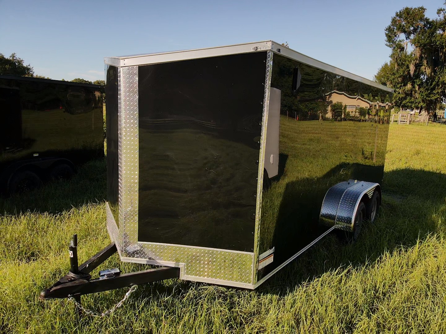 Black / chrome enclosed trailer — reference photograph